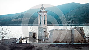 Ruined old church in Alassa, Cyprus submerged under the water of Kouris dam
