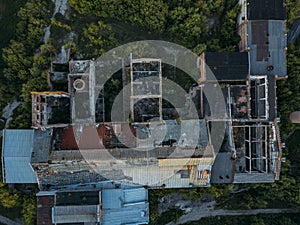 Ruined overgrown abandoned sugar factory in Ramon, aerial view