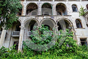 Ruined overgrown old abandoned Soviet sanatorium Iveria, Tskaltubo, Georgia photo