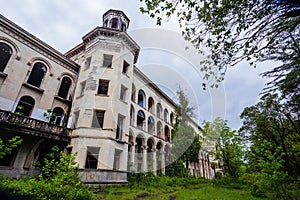 Ruined overgrown old abandoned Soviet sanatorium Iveria, Tskaltubo, Georgia photo