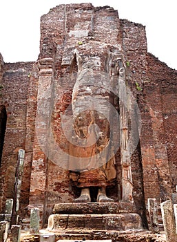 The ruined standing Buddha statue