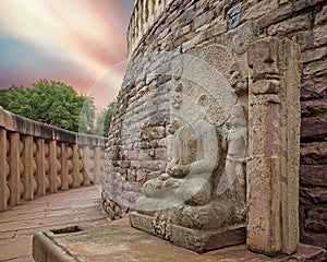 A ruined statue of Gautam Buddha placed beside one of the stupas at Sanchi