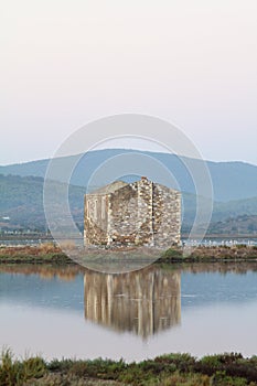 Ruined stone house and reflection