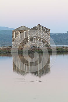 Ruined stone house and reflection