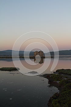 Ruined stone house and reflection