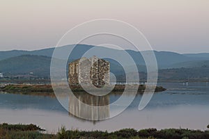 Ruined stone house and reflection