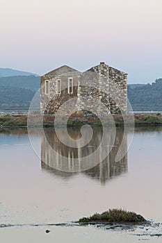 Ruined stone house and reflection