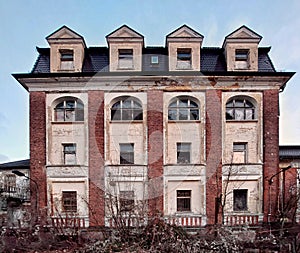 Ruined villa in Germany in dead winter shrubbery