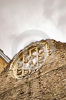 The ruined wall of bricks in london and also htere is window