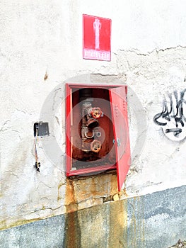 Ruined wall with fire hydrant.