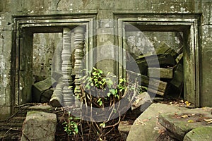 Ruined windows and debris in Cambodia monument