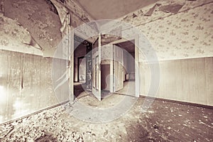 Ruinous empty room with old wallpapers photo