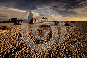 Ruinous Hindu temple on the sand photo