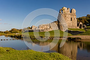 Ruins of a 12th century Welsh castle in the rural countryside Ogmore Castle, Glamorgan