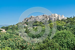 Ruins of Acropolis with  Parthenon, Erechtheum, Beule Gate and Temple of Athena in the city center with green trees in summer,
