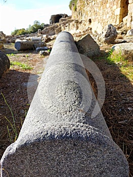 ruins of ancient ancient city, streets, columns, buildings scattered stones and parts of ruins and artifacts