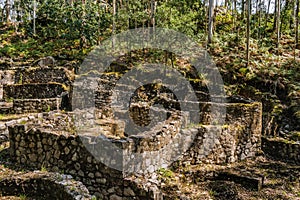 Selective focus on stone walls of ruins of ancient Roman settlement in Castro de SÃÂ£o LourenÃÂ§o, Vila ChÃÂ£ - Esposende PORTUGAL photo
