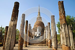 On the ruins of ancient Buddhist temple. Sukhothai, Thailand