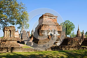 On the ruins of an ancient Buddhist temple Wat Mahathat. Sukhothai, Thailand