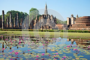 The ruins of an ancient Buddhist temple Wat Mahathat. Sunny morning. Sukhothai, Thailand