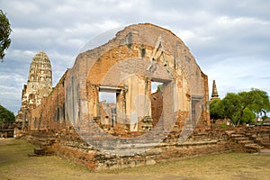 Ruins of the ancient Buddhist temple of Wat Ratchaburana Wat Rat Burana close up in the early cloudy morning. Ayutthaya, Thailan