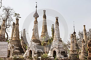 Ruins of ancient Burmese Buddhist pagodas Nyaung Ohak in the village of Indein on Inlay Lake