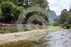 Ruins of the ancient city of Olympos in Cirali village in Antalya, Turkey. Local and foreign tourists come to visit the ancient ci
