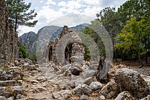 Ruins of the ancient city of Olympos in Cirali village in Antalya, Turkey. Local and foreign tourists come to visit the ancient ci