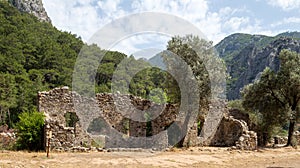 Ruins of the ancient city of Olympos in Cirali village in Antalya, Turkey. Local and foreign tourists come to visit the ancient ci