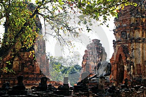 The ruins of ancient city with statue of Buddha. Ayutthaya Historical park.