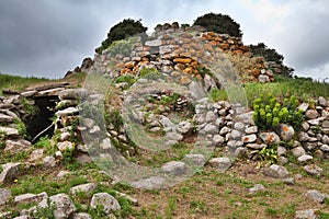 Ruins of ancient culture Sardinia Nuraghe tower photo