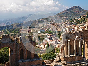 Ruins of the ancient Greek theater and view of Taormina, Sicily.