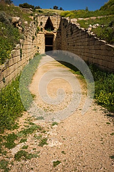 Ruins of ancient Greek tomb in Mycenae on Peloponnese, Greece