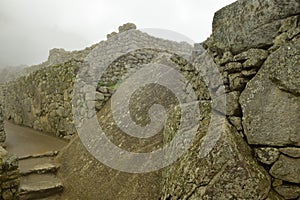 Ruins of the ancient Inca city machu picchu in fog, Peru