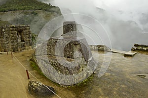 Ruins of the ancient Inca city machu picchu in fog, Peru