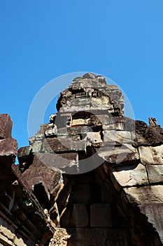 The ruins of an ancient Khmer temple Baphuon. The ruins of ancient civilizations. Magnificent stone buildings of Southeast Asia