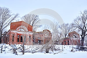 Ruins of an ancient manor house, covered with snow. abandoned winter landscape