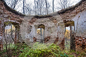 The ruins of an ancient red brick church with remnants of white plaster