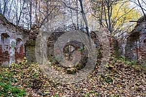 The ruins of an ancient red brick church with remnants of white plaster