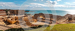 Ruins of ancient Roman amphitheater built during the Roman empire, Romanesque church inside, city of Tarraco - Tarragona, photo