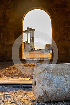 Ruins of ancient Temple of Apollo in Side on sunset in arch, Alanya province, Turkey. Ruined old city. Unesco Cultural