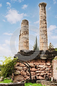 Ruins of an ancient temple, Temple Of Apollo At Delphi Oracle, Greece, ncient greek columns against blue sky photo