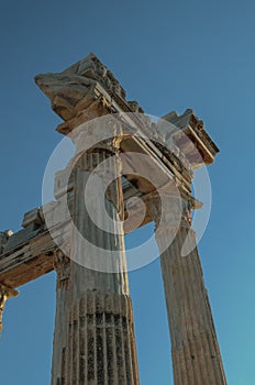 The ruins of an antique Temple against the blue sky