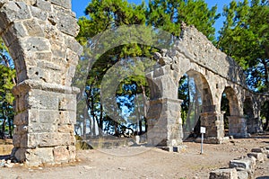 Ruins of aqueduct in ancient city of Phaselis near Camyuva, Turkey