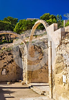 Ruins of arched gates at Santa Barbara Castle in Alicante, Spain photo