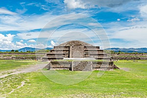 Ruins of the architecturally significant Mesoamerican pyramids and green grassland located at at Teotihuacan, an ancient