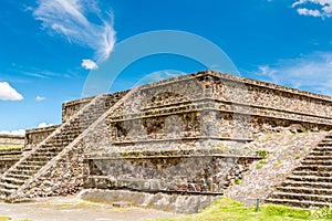 Ruins of the architecturally significant Mesoamerican pyramids and green grassland located at at Teotihuacan, an ancient