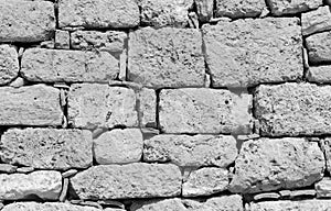 Ruins of atique stone wall background black and white