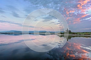 Ruins of Azua church with reservoir reflections