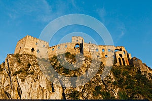 Ruins of Beckov Castle during sunset time from east side, Slovakia